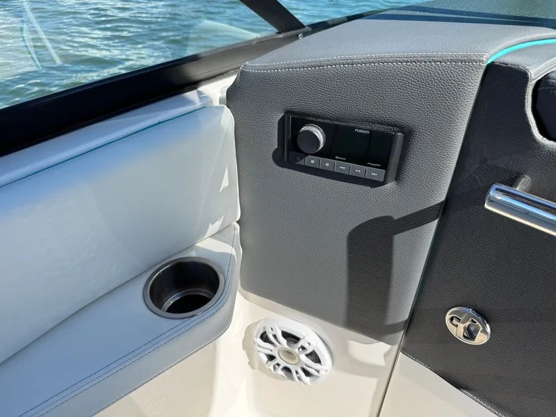 Slide: The Image of Interior of a 2022 Regal LX4 boat with audio system. - 41