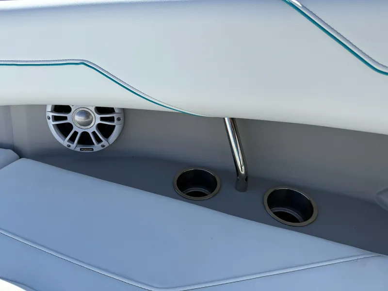 Slide: The Image of Interior of a Regal LX4 boat with speaker and cup holders. - 42