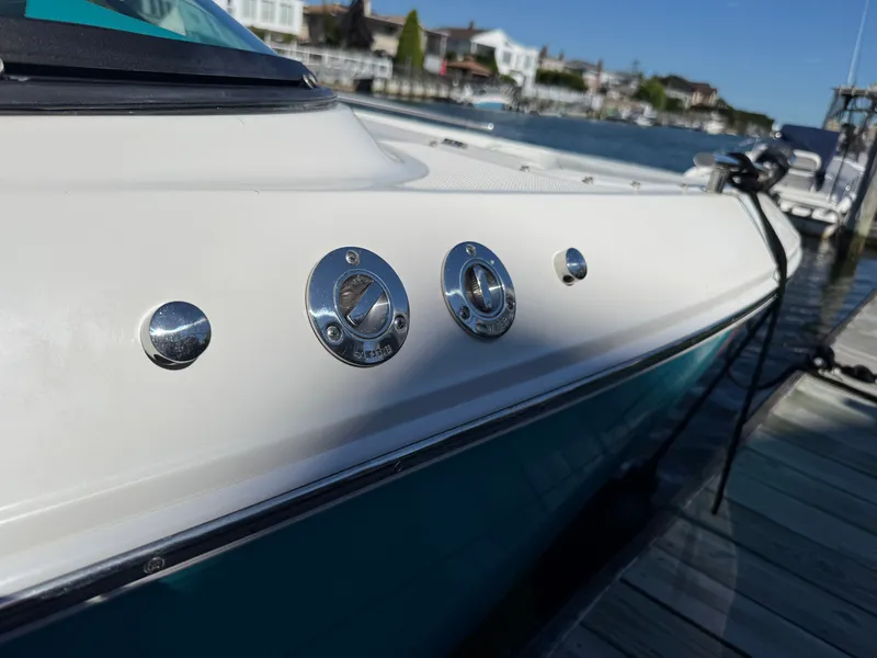 Slide: The Image of Regal LX4 2022 boat docked with water in the background. - 43