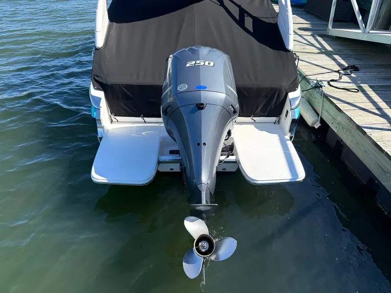 Slide: The Image of Regal LX4 2022 boat with outboard motor on water. - 5