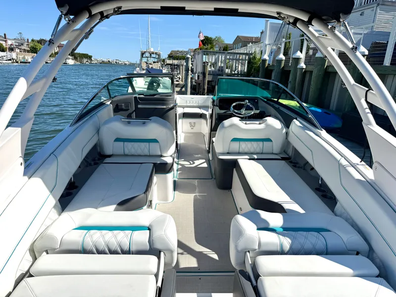 Slide: The Image of Interior of a 2022 Regal LX4 boat with luxurious seating. - 7
