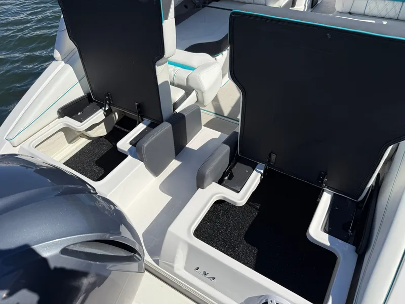 Slide: The Image of Regal LX4 2022 boat at dock with luxurious seating. - 9
