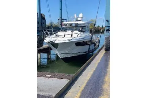 Slide: The Image of 2021 Jeanneau Leader 12.5 WA boat docked, ready for launch. - 23
