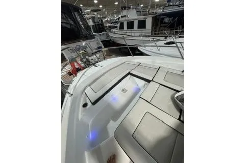 Slide: The Image of 2021 Jeanneau Leader 12.5 WA boat interior with modern design and ambient lighting. - 11