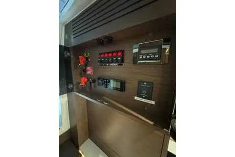 Slide: The Image of Control panel of 2021 Jeanneau Leader 12.5 WA boat with various switches and displays. - 41