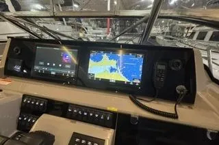 Slide: The Image of 2021 Jeanneau Leader 12.5 WA dashboard with navigation screens and controls. - 17