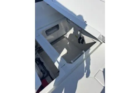 Slide: The Image of 2021 Jeanneau Leader 12.5 WA boat storage compartment with open hatch. - 44