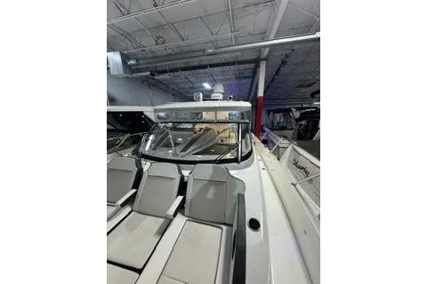 Slide: The Image of 2021 Jeanneau Leader 12.5 WA boat in indoor storage, showcasing sleek design and modern features. - 9