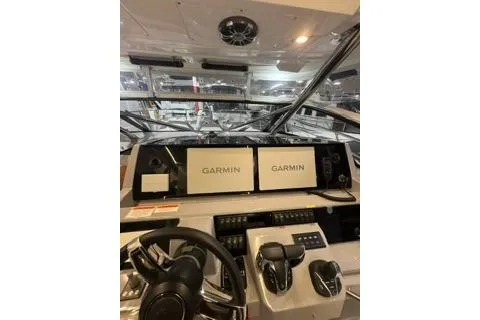 Slide: The Image of 2021 Jeanneau Leader 12.5 WA helm with dual Garmin displays and modern controls. - 19