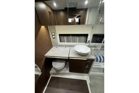 Slide: The Image of 2021 Jeanneau Leader 12.5 WA yacht bathroom with modern fixtures and sleek design. - 31