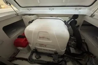 Slide: The Image of 2021 Jeanneau Leader 12.5 WA engine compartment with equipment and storage. - 42