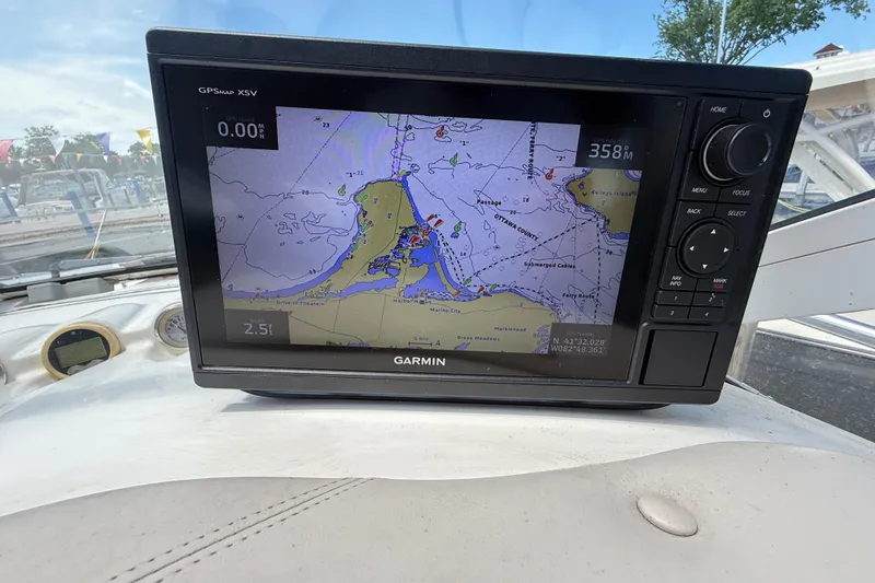 Slide: The Image of Garmin GPS display on 2001 Doral 330se boat, showing nautical map and navigation details. - 18