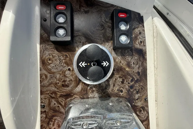 Slide: The Image of Control panel of a 2001 Doral 330se boat with wood grain finish. - 19