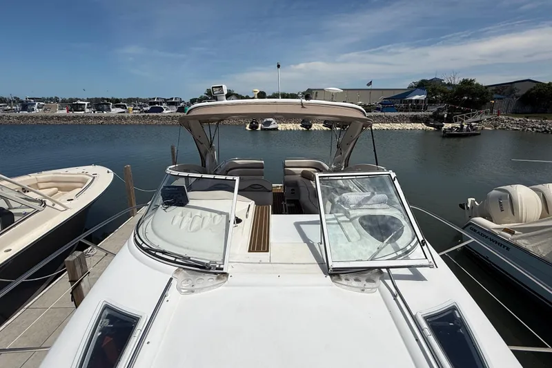 Slide: The Image of 2001 Doral 330se boat docked at marina under clear blue sky. - 20