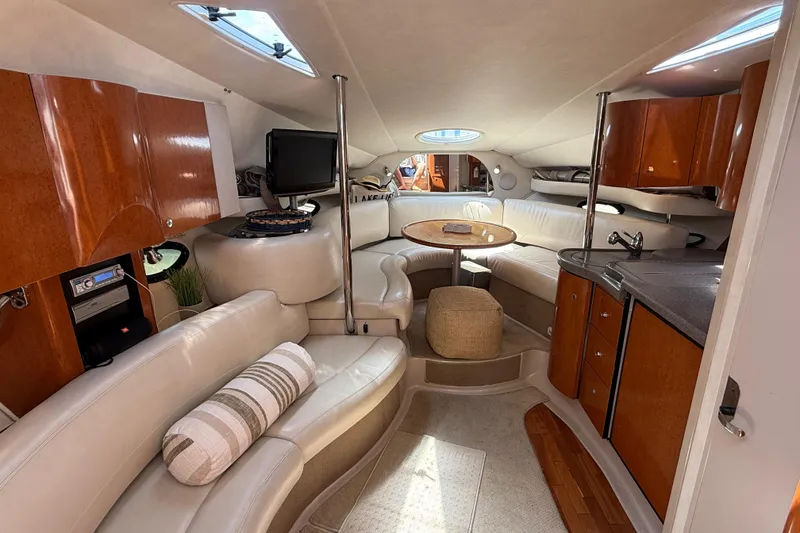 Slide: The Image of Luxurious interior of a 2001 Doral 330se yacht with elegant seating and wood finishes. - 23