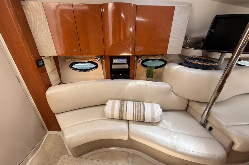Slide: The Image of Interior of a 2001 Doral 330se yacht with elegant seating and wooden cabinetry. - 28