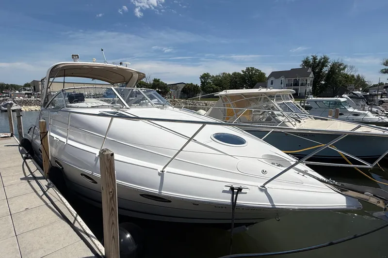 Slide: The Image of 2001 Doral 330se boat docked at marina under clear blue sky. - 3