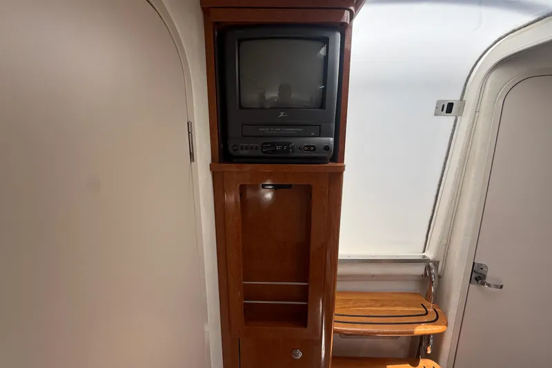 Slide: The Image of 2001 Doral 330se interior with vintage TV and wooden cabinetry. - 30