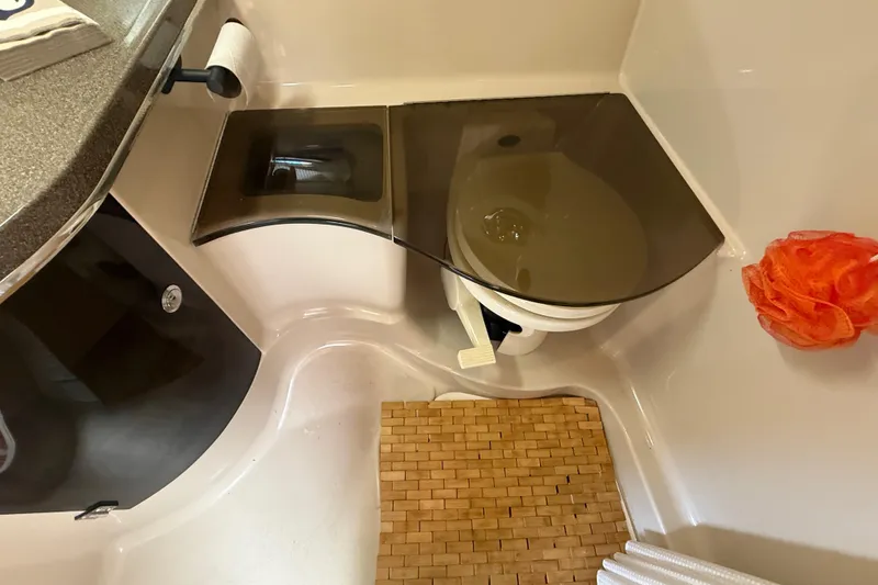 Slide: The Image of Bathroom interior of 2001 Doral 330se boat with toilet and sink. - 33