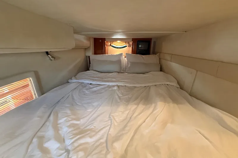 Slide: The Image of Cozy cabin interior of 2001 Doral 330se with comfortable bedding and ambient lighting. - 38