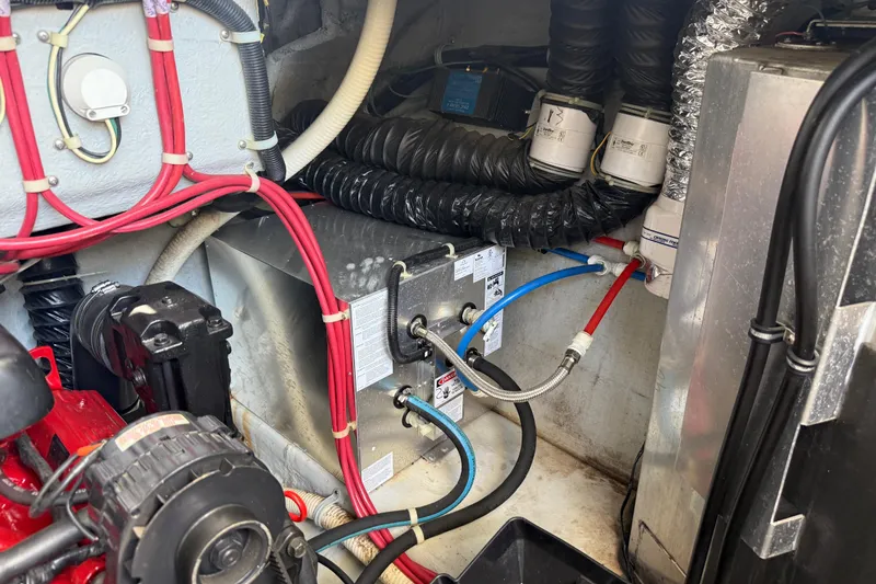 Slide: The Image of Engine compartment of a 2001 Doral 330se with visible wiring and components. - 45