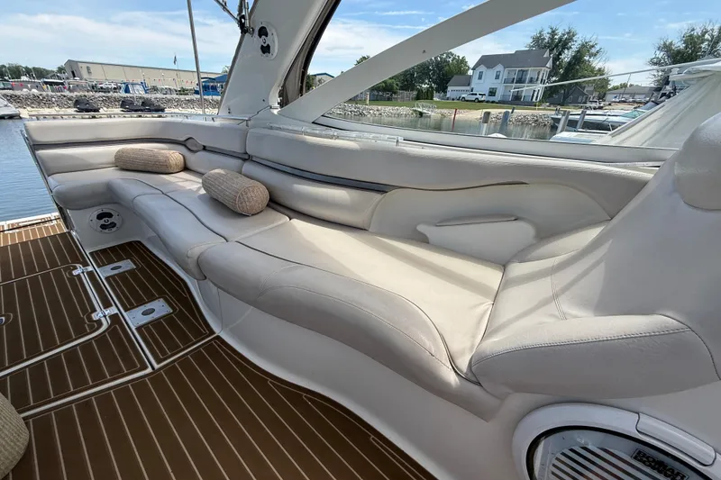 Slide: The Image of Luxurious seating area on a 2001 Doral 330se boat, featuring plush cushions and elegant design. - 9
