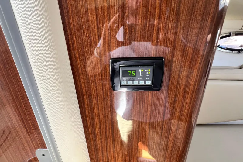 Slide: The Image of Thermostat on 2015 Regal 30 Express boat, set to 75 degrees, mounted on wood panel. - 18