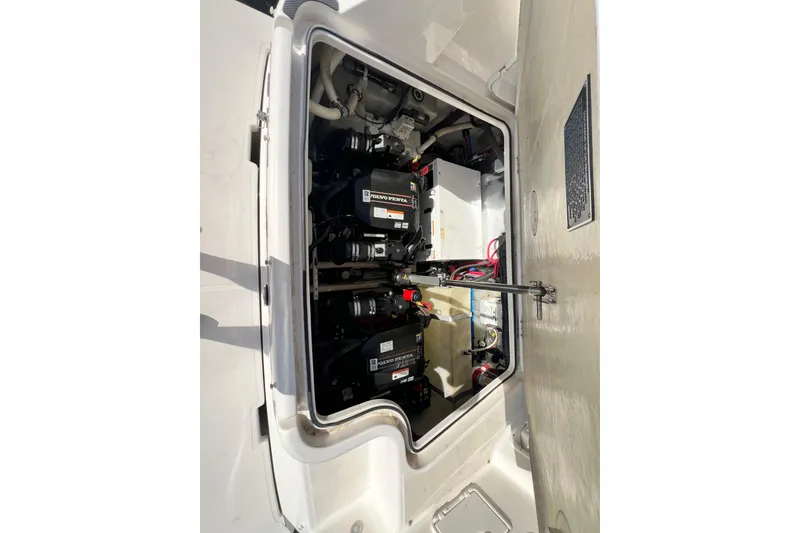 Slide: The Image of Engine compartment of a 2015 Regal 30 Express boat, featuring Volvo Penta engines. - 24