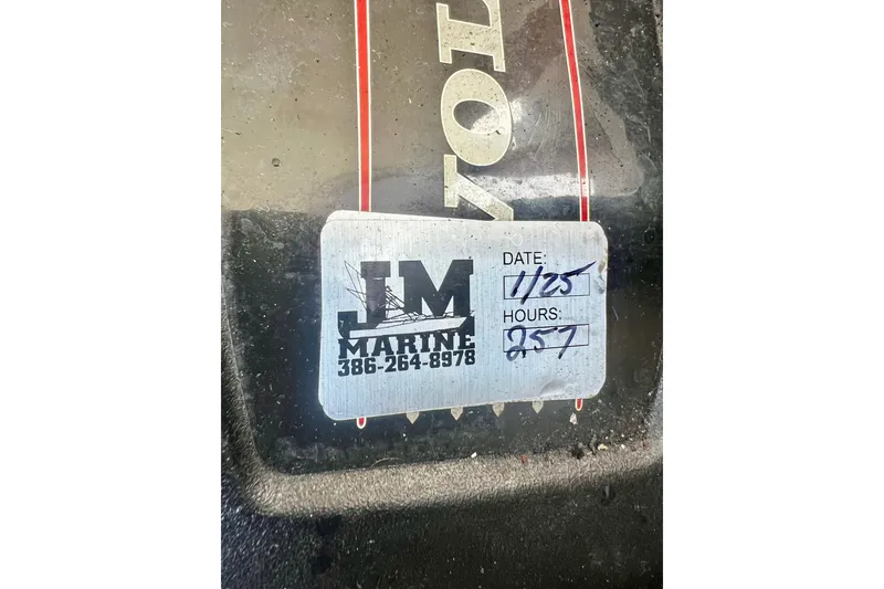Slide: The Image of Sticker on Regal 30 Express 2015 boat engine, showing service date and hours. - 35