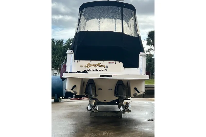Slide: The Image of 2015 Regal 30 Express boat with black cover, docked in Daytona Beach, FL. - 6