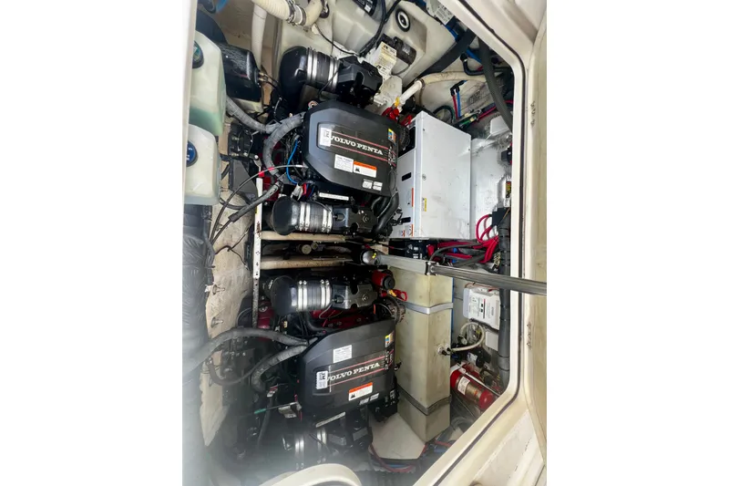 Slide: The Image of Engine compartment of a 2015 Regal 30 Express boat with Volvo Penta engines. - 34