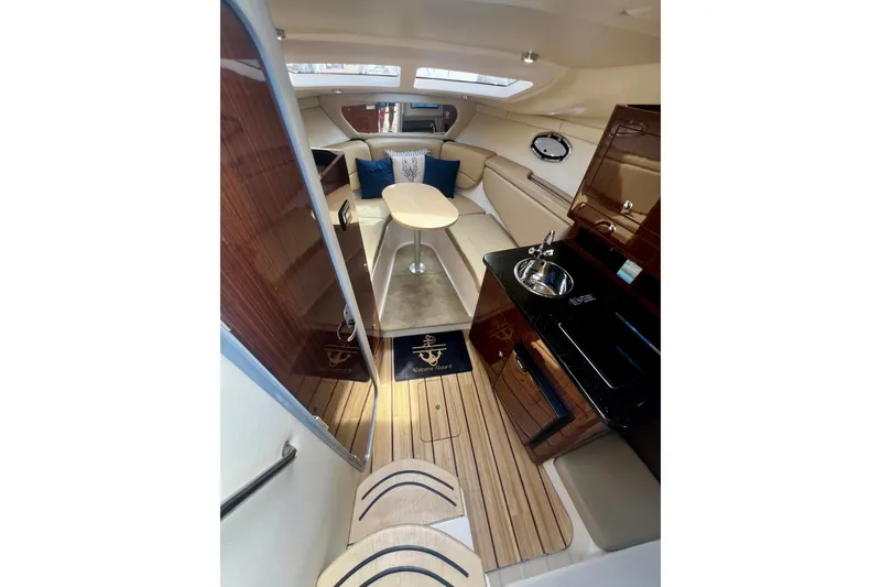 Slide: The Image of Luxurious interior of 2015 Regal 30 Express yacht with modern kitchen and seating area. - 20