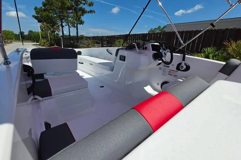 Slide: The Image of Interior of 2026 Tahoe T18 boat with modern seating and steering wheel. - 15