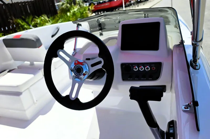 Slide: The Image of 2026 Tahoe T18 boat cockpit with steering wheel and control panel. - 12