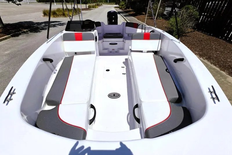 Slide: The Image of 2026 Tahoe T18 boat interior with white and gray seating, red accents, and spacious layout. - 13