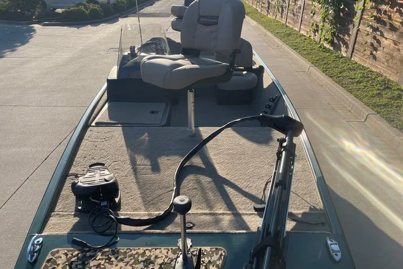 Slide: The Image of 2026 Tracker Bass Tracker Classic Limited boat with seating and fishing equipment on deck. - 46