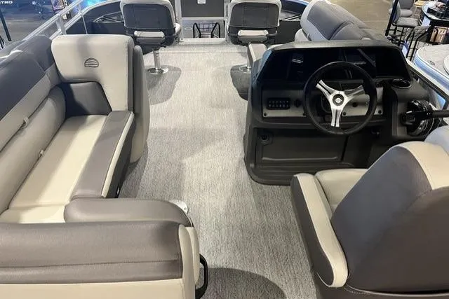 Slide: The Image of Interior view of 2026 Sun Tracker Fishin' Barge 20 DLX with seating and steering console. - 6
