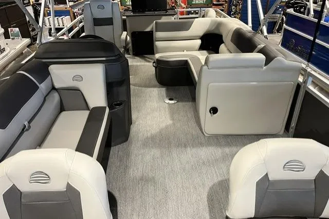 Slide: The Image of 2026 Sun Tracker Fishin' Barge 20 DLX interior with spacious seating and modern design. - 5