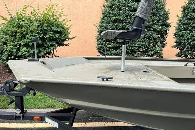 Slide: The Image of 2026 Tracker Grizzly 1654 T Sportsman boat on trailer, featuring a mounted seat. - 5