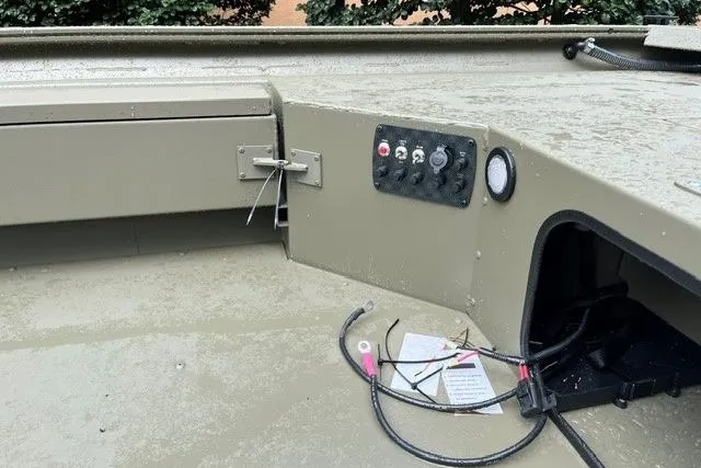 Slide: The Image of 2026 Tracker Grizzly 1654 T Sportsman boat interior with control panel and wiring. - 12