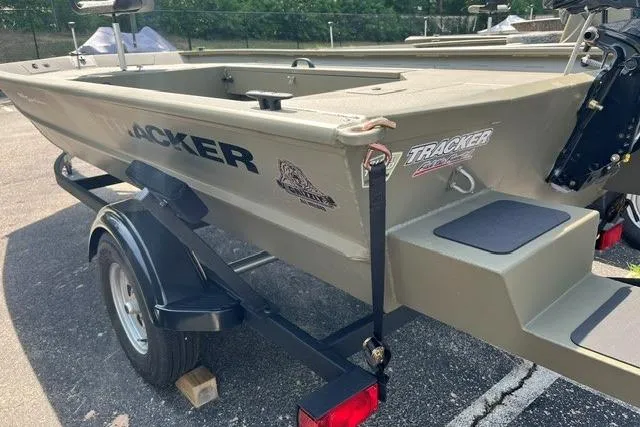 Slide: The Image of 2026 Tracker Grizzly 1654 T Sportsman boat on trailer, side view. - 7