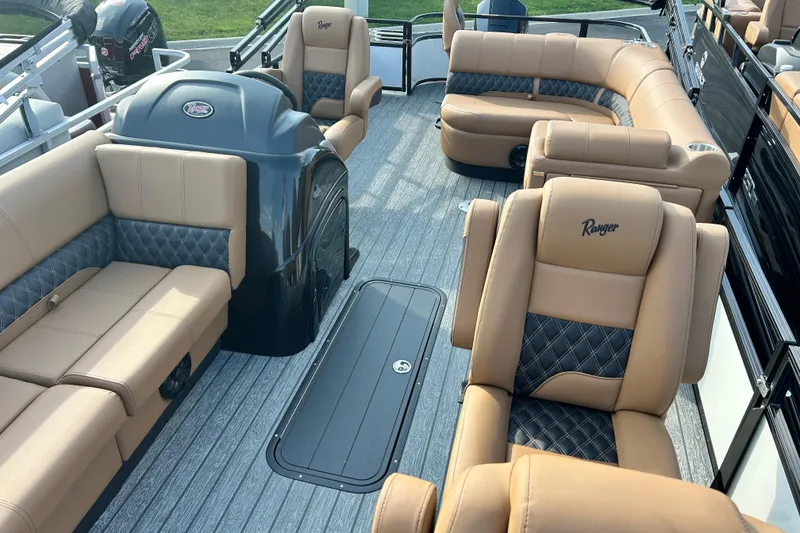 Slide: The Image of Luxurious 2026 Ranger 223FC boat interior with tan and black seating, showcasing modern design. - 6
