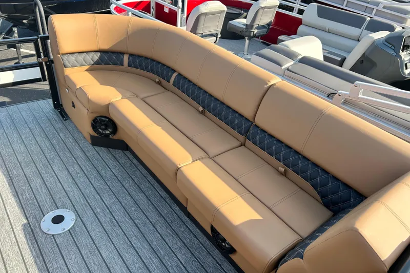 Slide: The Image of Luxurious seating on 2026 Ranger 223FC boat with tan and black upholstery. - 12