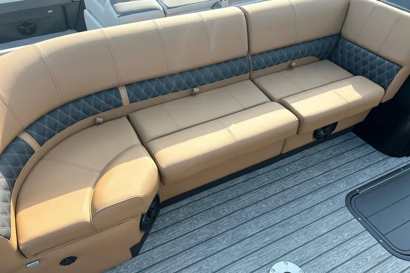 Slide: The Image of Luxurious seating on 2026 Ranger 223FC boat with tan and quilted upholstery. - 9