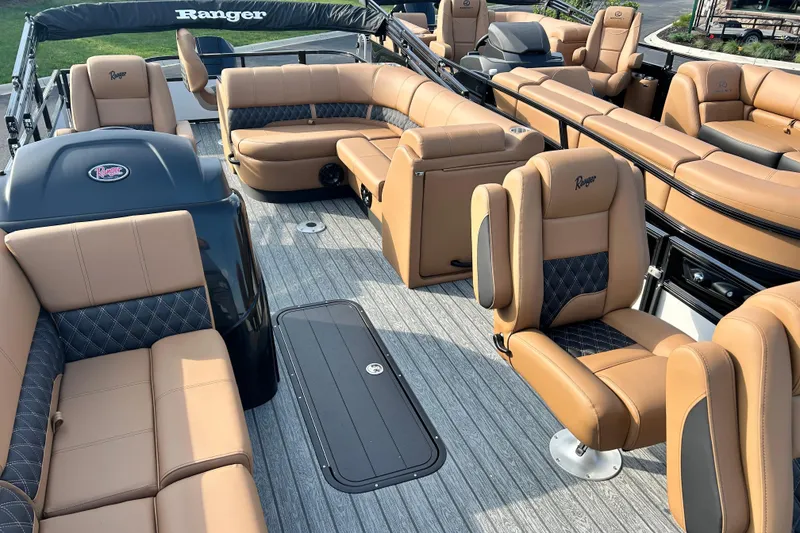 Slide: The Image of Luxurious interior of 2026 Ranger 223FC boat with tan leather seating and modern design. - 7