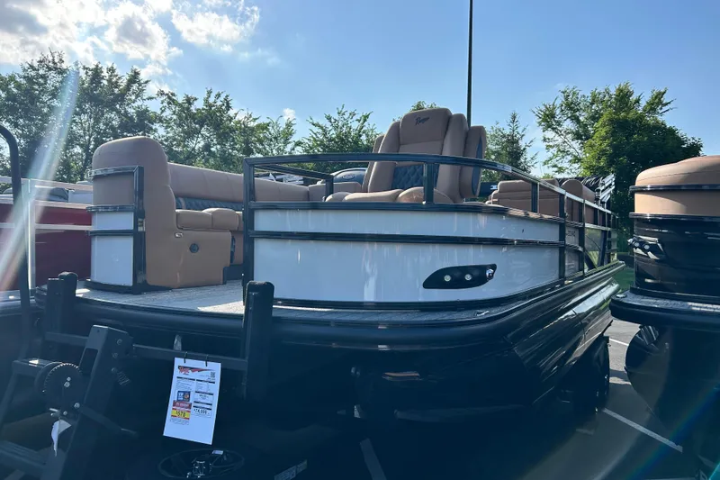The Image of 2026 Ranger 223FC pontoon boat with tan seating, displayed outdoors. - 0