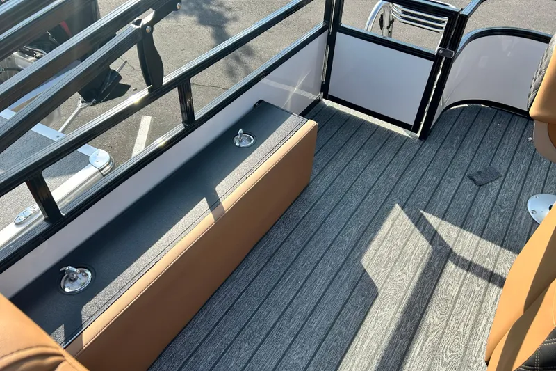 Slide: The Image of Interior of 2026 Ranger 223FC boat with sleek seating and modern flooring. - 14