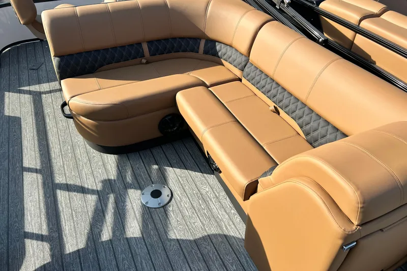 Slide: The Image of Luxurious tan seating on 2026 Ranger 223FC boat, featuring quilted accents and sleek flooring. - 10