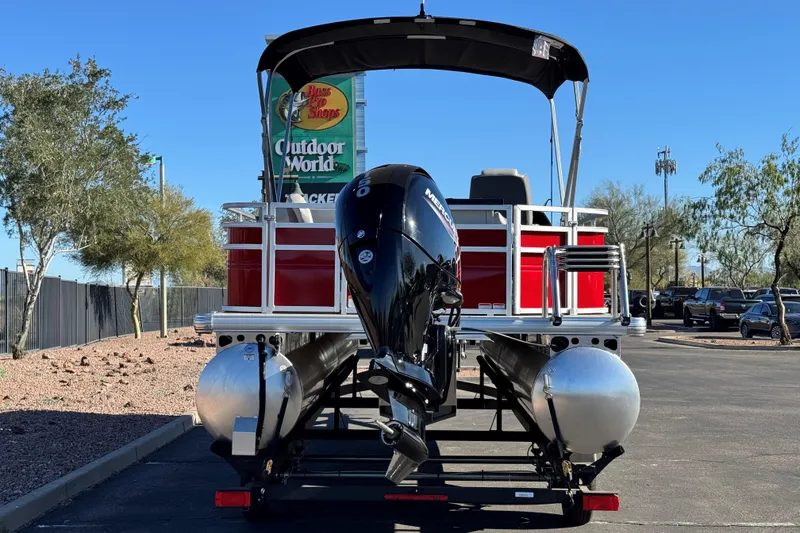Slide: The Image of 2026 Sun Tracker Fishin' Barge 22 DLX pontoon boat at Outdoor World parking lot. - 3