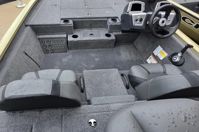 Slide: The Image of 2026 Tracker Pro Team 195 boat interior with steering wheel and seating. - 3